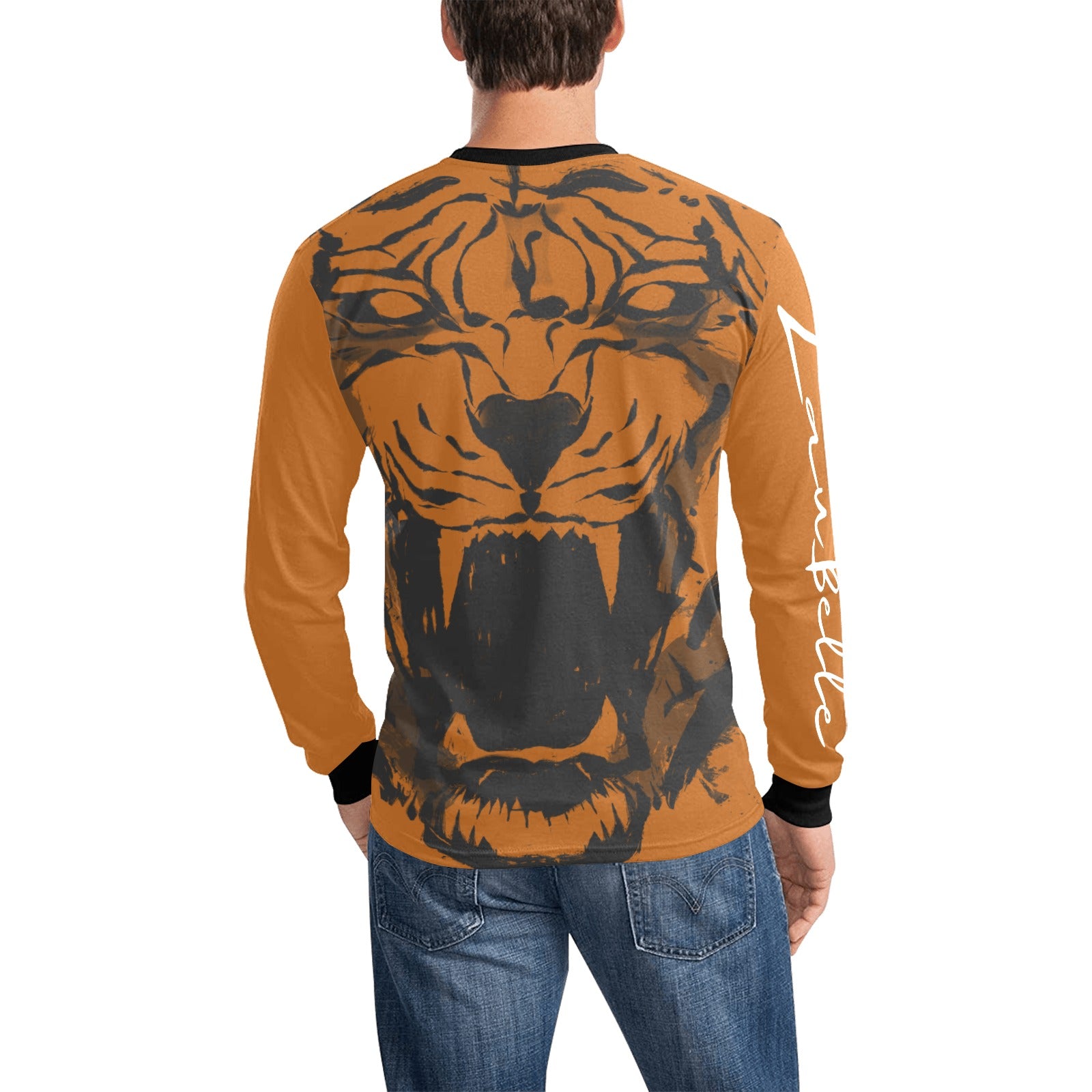 Man in an orange shirt with a roaring tiger graphic, black cuffs, and blue jeans.