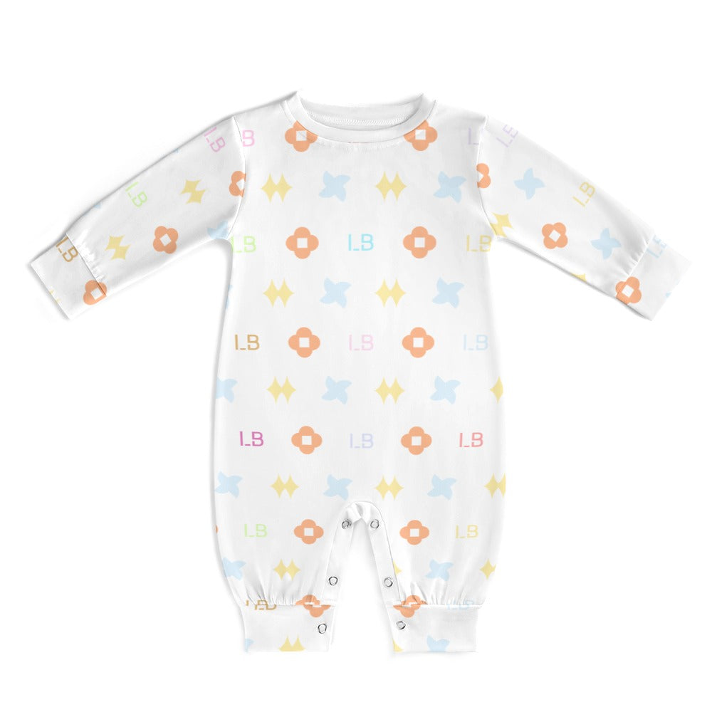 White baby onesie with colorful floral and letter patterns, featuring snaps at the legs.
