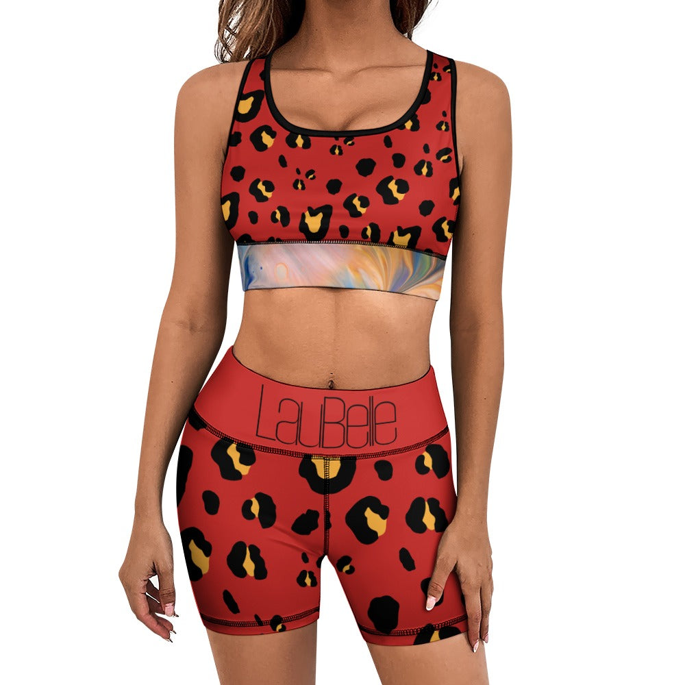 Woman in red leopard print sports outfit with multicolored waistband, standing against a white background.