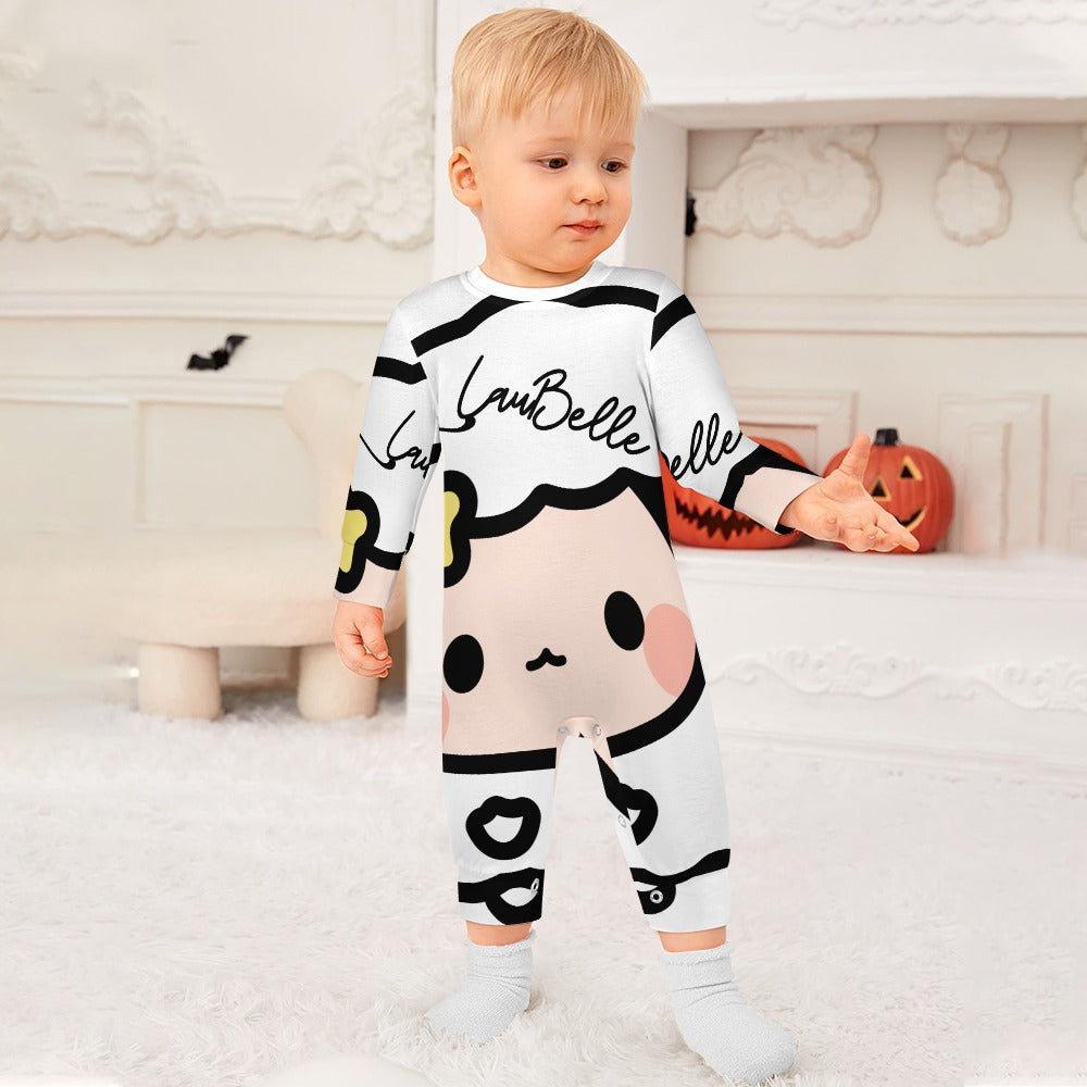 Toddler in a white and black cartoon-themed onesie, standing on a soft, white carpeted floor.