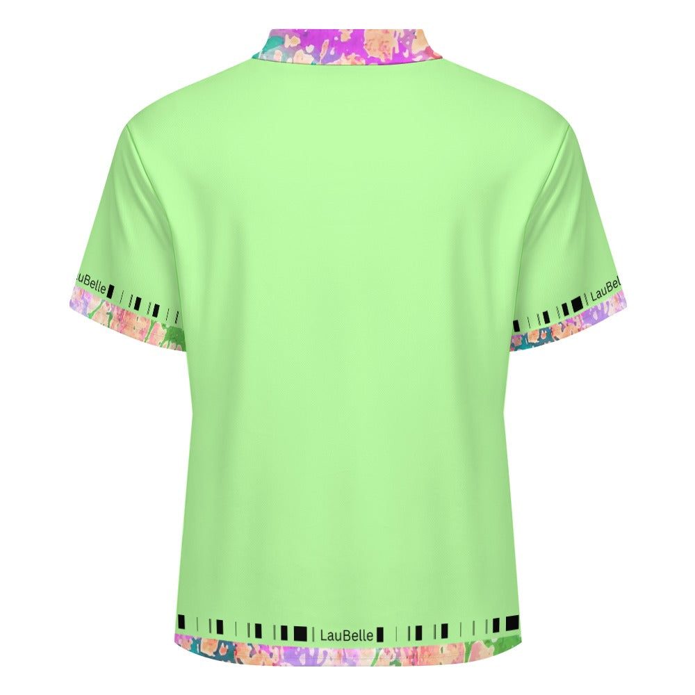 Light green shirt with colorful abstract patterns on the collar and sleeve cuffs.