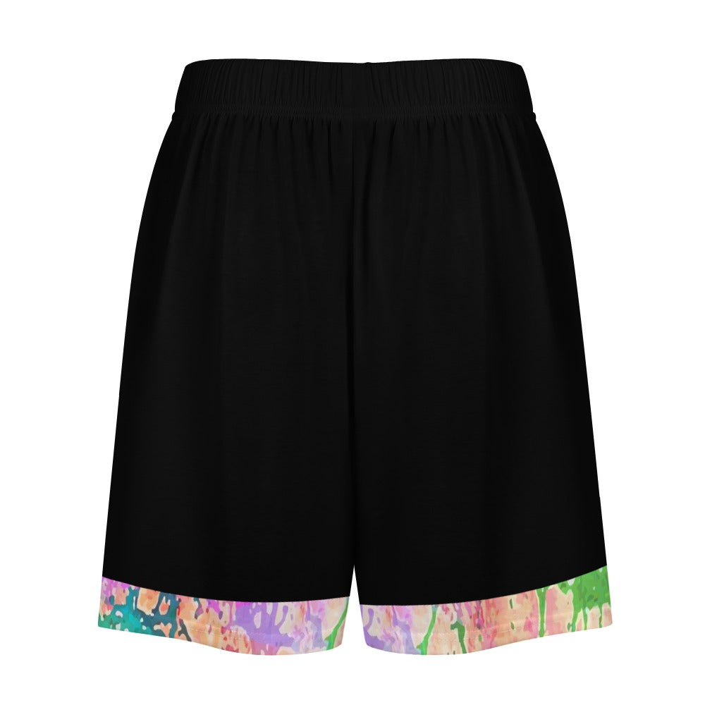Black shorts with a colorful abstract pattern trim at the hem in green, purple, and pink.