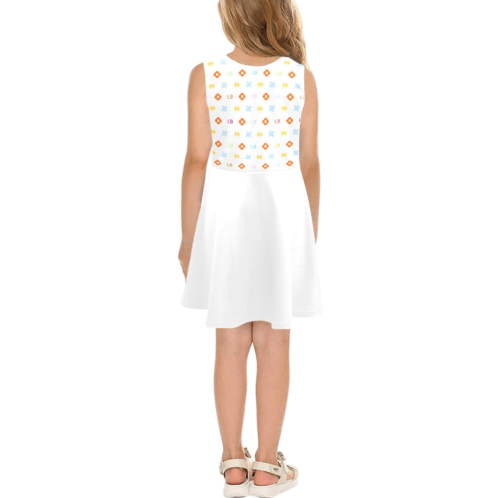 Girl in a white dress with colorful geometric patterns on top, seen from behind.
