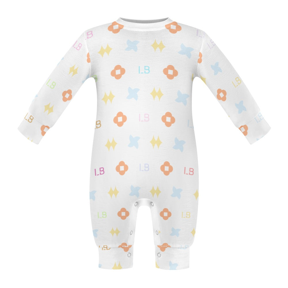 White baby onesie with colorful floral and geometric patterns in orange, blue, and pink.