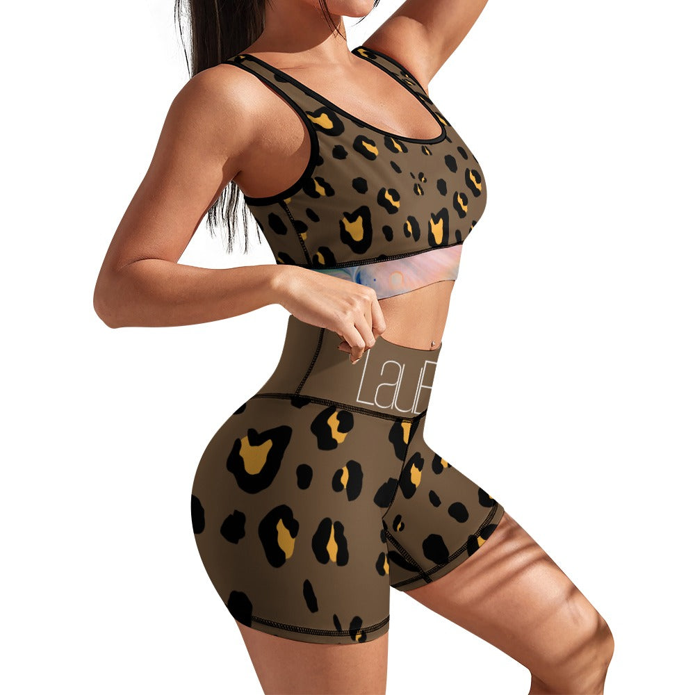 Woman in leopard print sports bra and shorts, posed in a fitness stance.