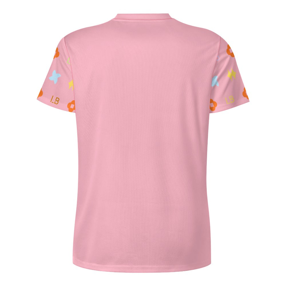 Back view of pink T-shirt with short sleeves featuring bright star and flower patterns.