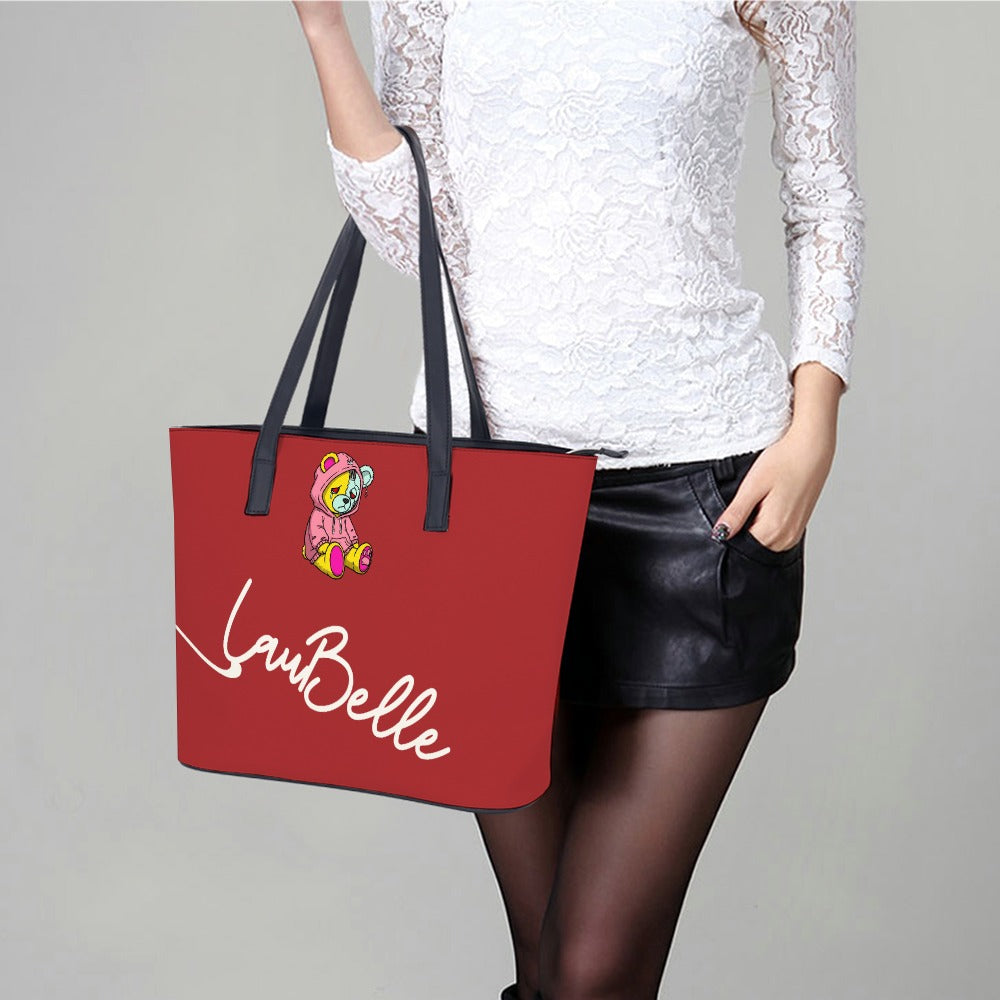 Woman in white lace top, black leather skirt, holding red tote with floral and text design.