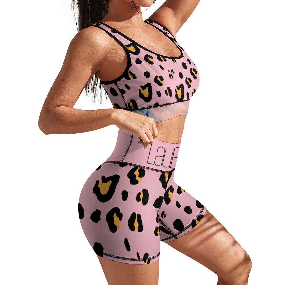 Woman in pink leopard print activewear, mid-stride, with long hair, against a white background.