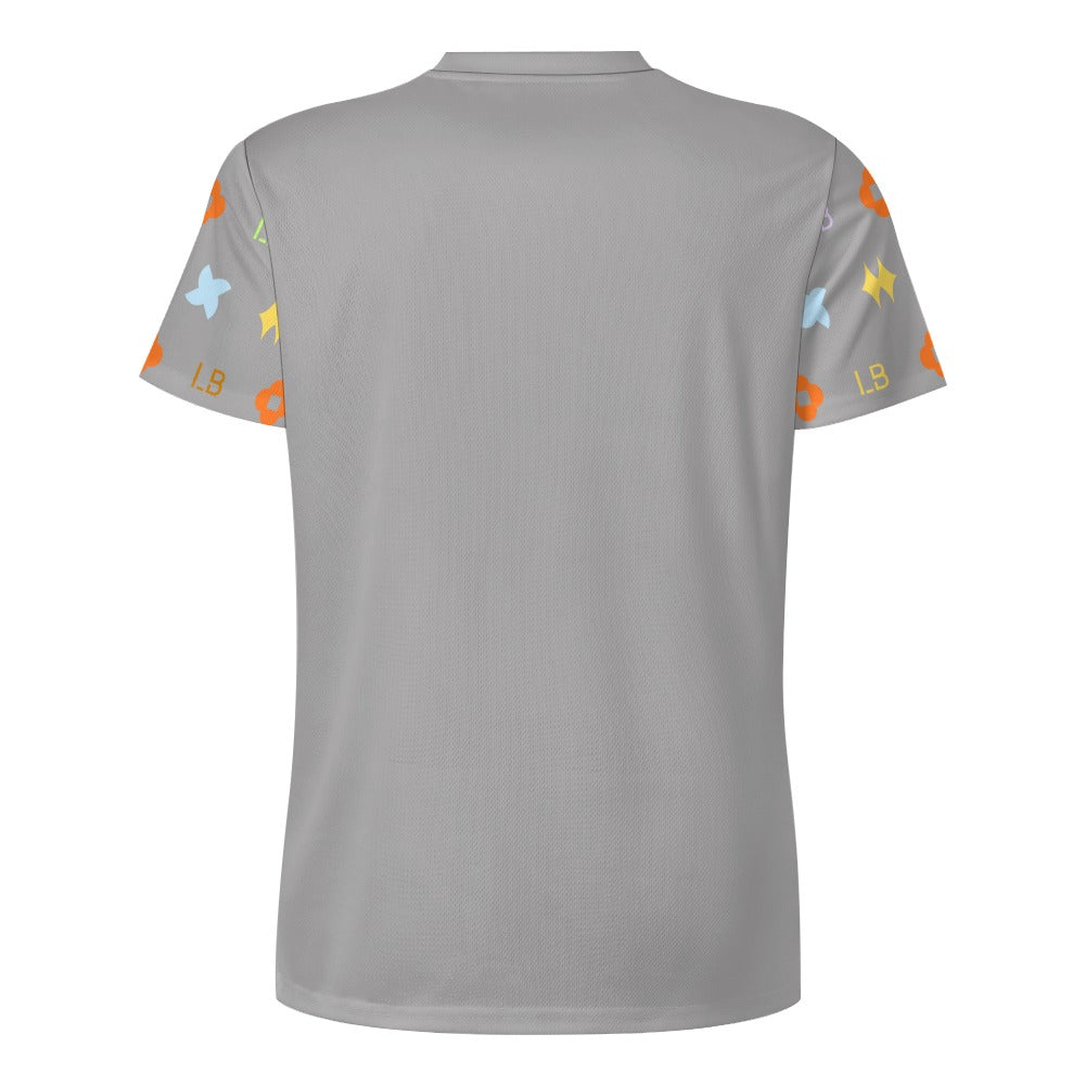 Back of gray T-shirt with short sleeves patterned with colorful stars and shapes.