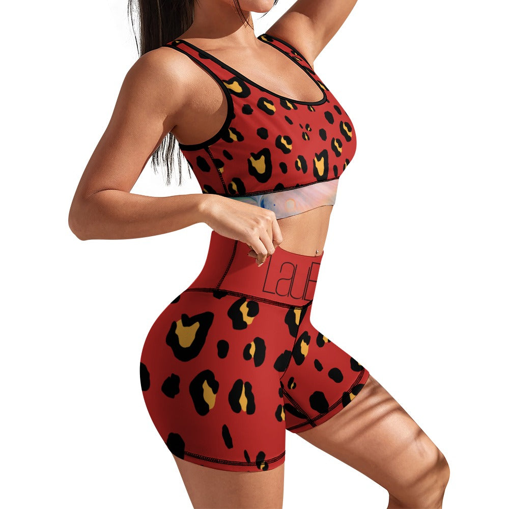 Woman in red leopard print workout set; tank top and shorts with black and yellow spots.
