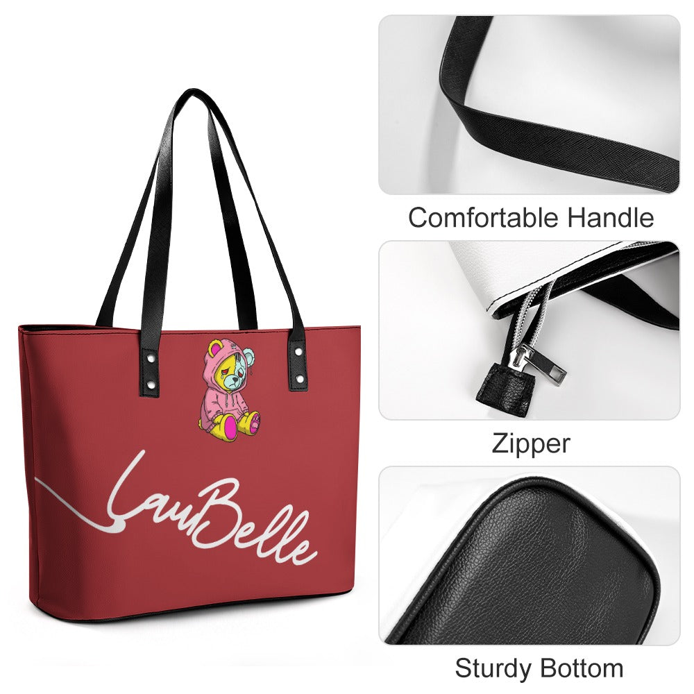 Red tote bag with black straps, bear design, zipper, and sturdy bottom; text reads "LaBelle."