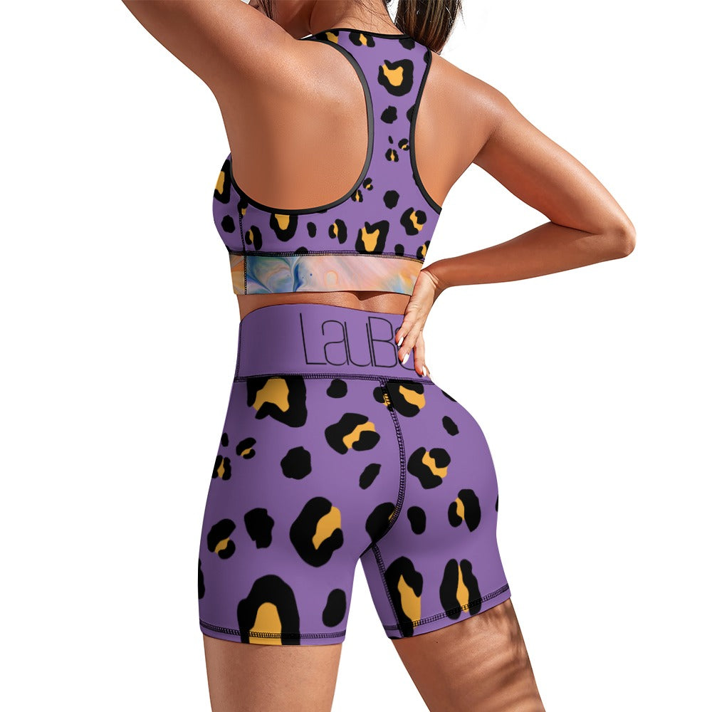 Woman in purple leopard-print sportswear, showing back view with racerback top and shorts.