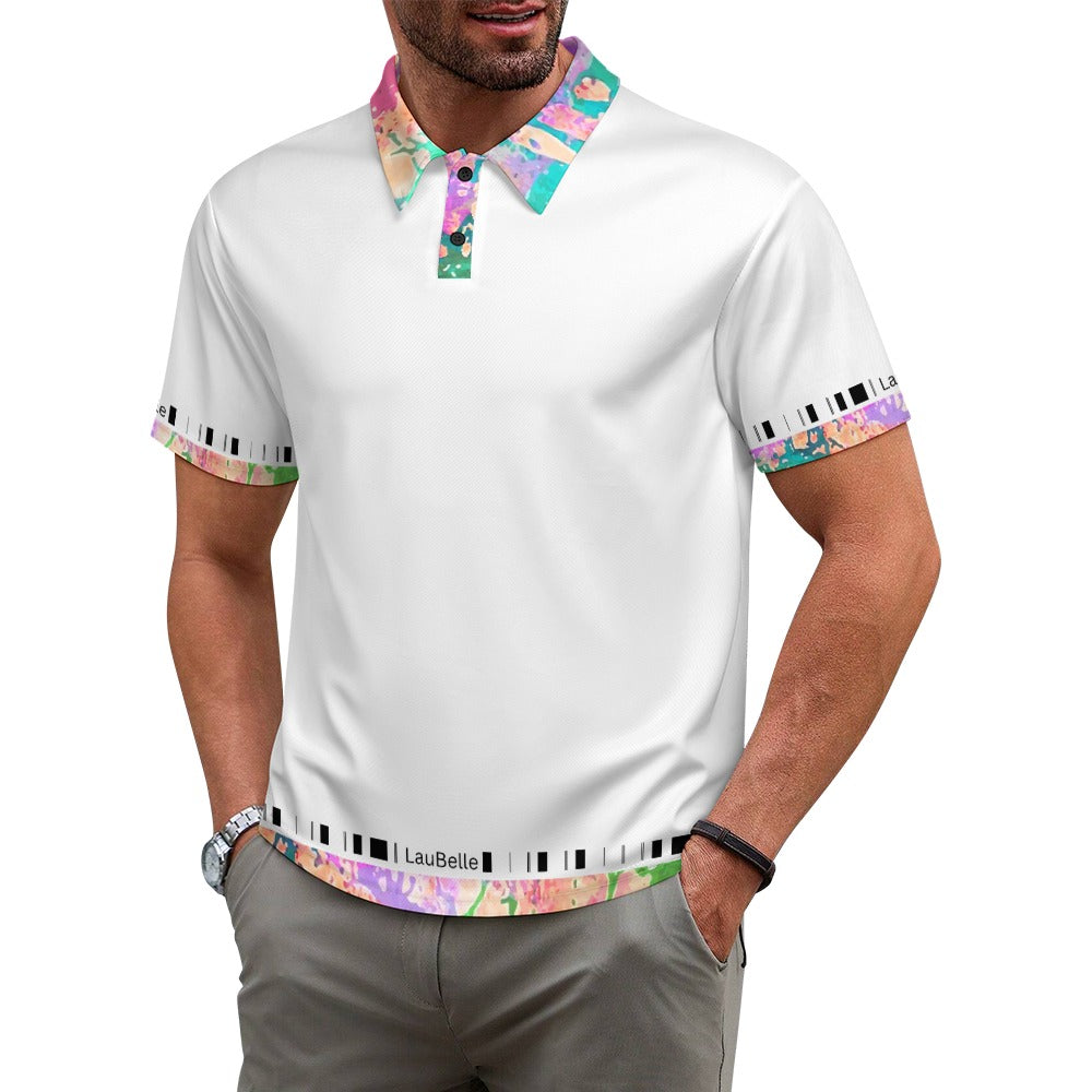 Man wearing a white polo with colorful floral collar and sleeve accents, hands in pockets.