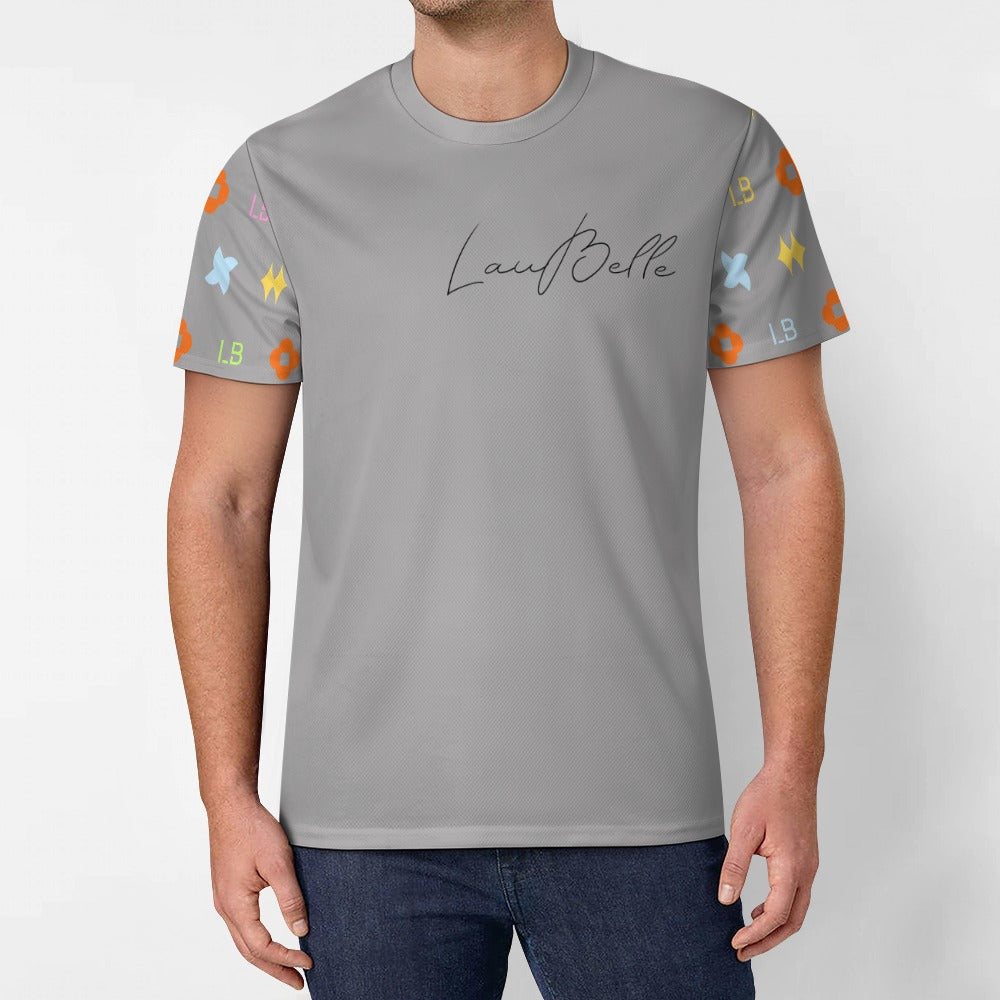 Man wearing gray T-shirt with cursive logo and colorful patterned short sleeves.