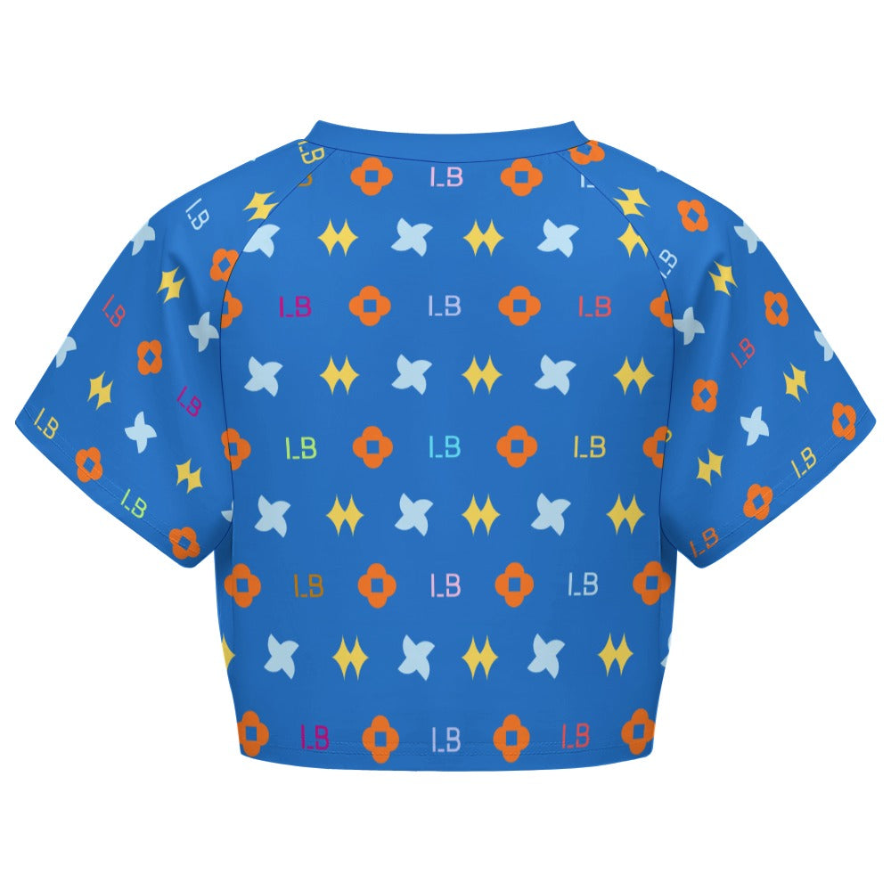 Blue cropped shirt with orange, yellow, and light blue geometric patterns and "L8" text.