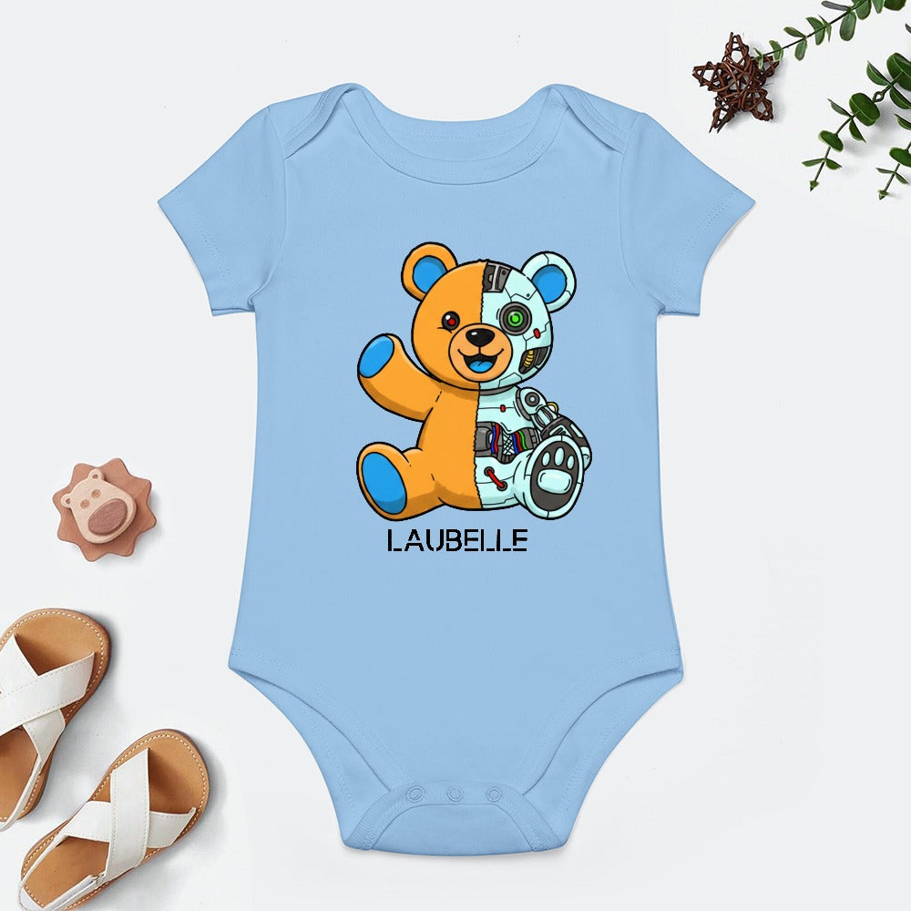 Blue baby romper with a split-design teddy bear, text "LAUBELLE," surrounded by toys and sandals.