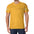 Man wearing yellow T-shirt with cursive logo on chest and colorful patterned short sleeves