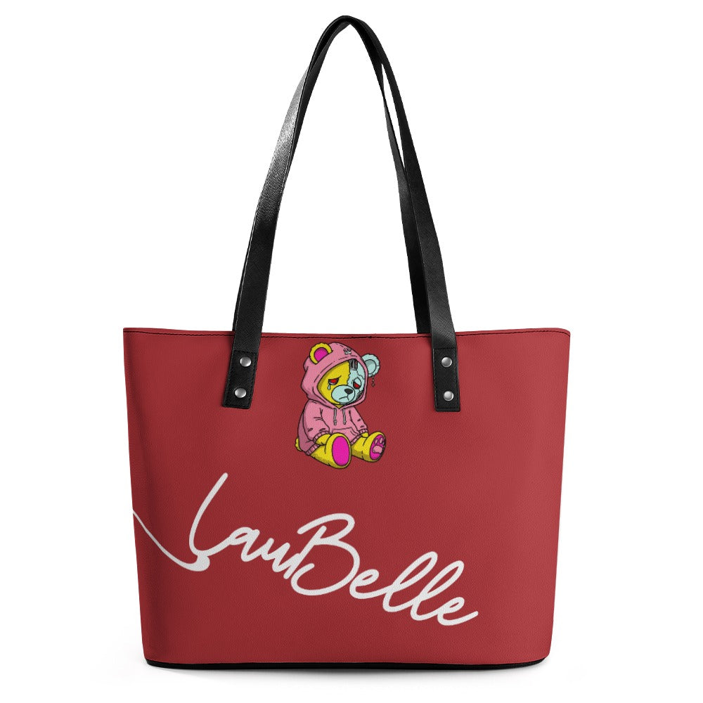 Red tote bag with black straps, featuring a cartoon bear and white cursive text.