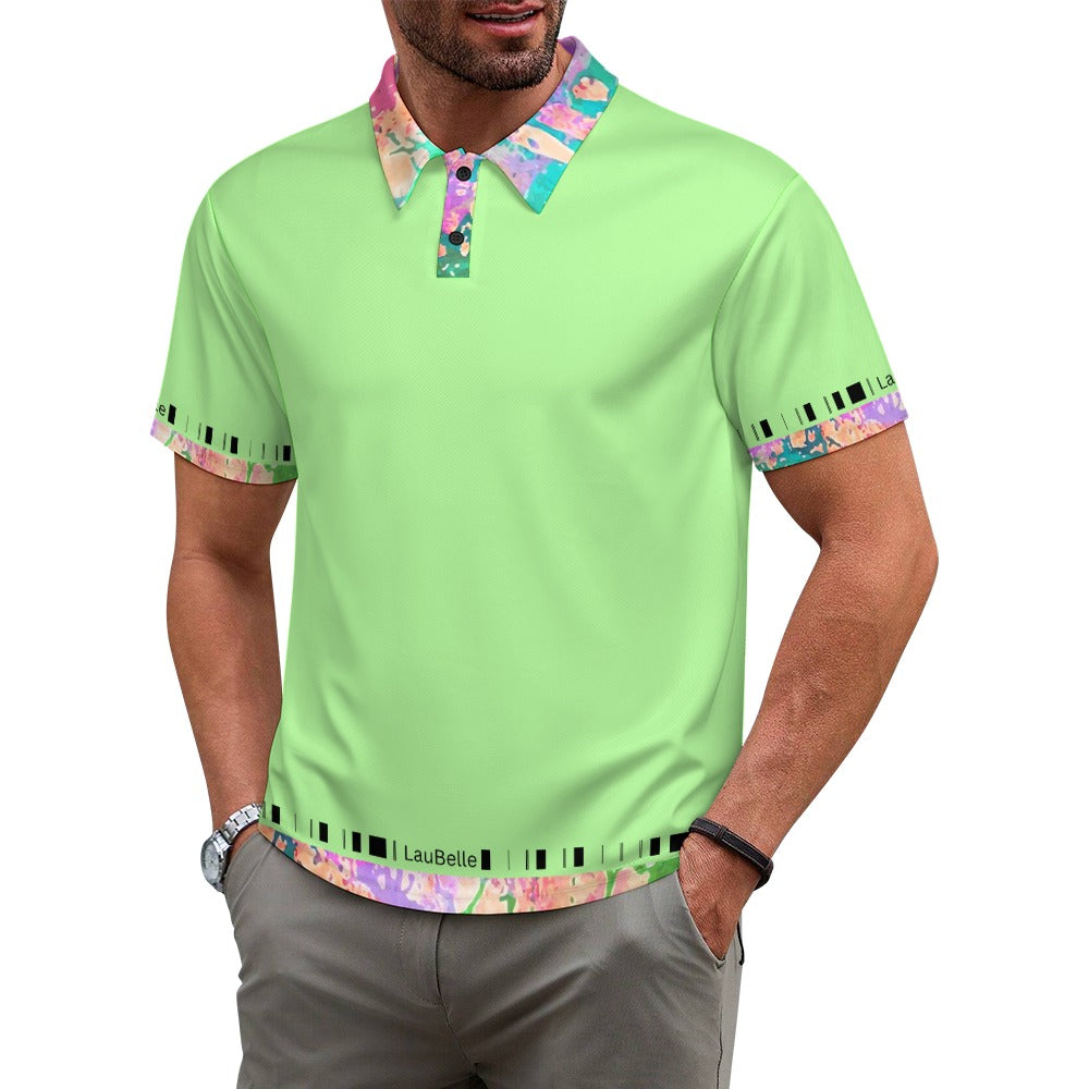 Man wearing a light green polo shirt with colorful floral collar and cuffs, and gray pants.