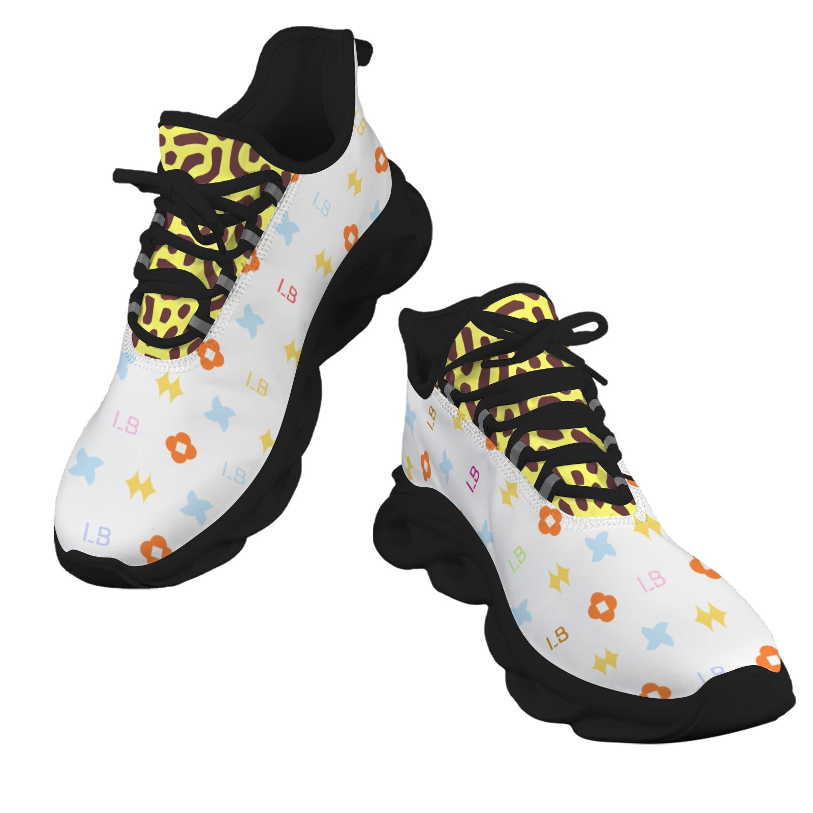 White sneakers with black soles, colorful pattern, black laces, and yellow accents.