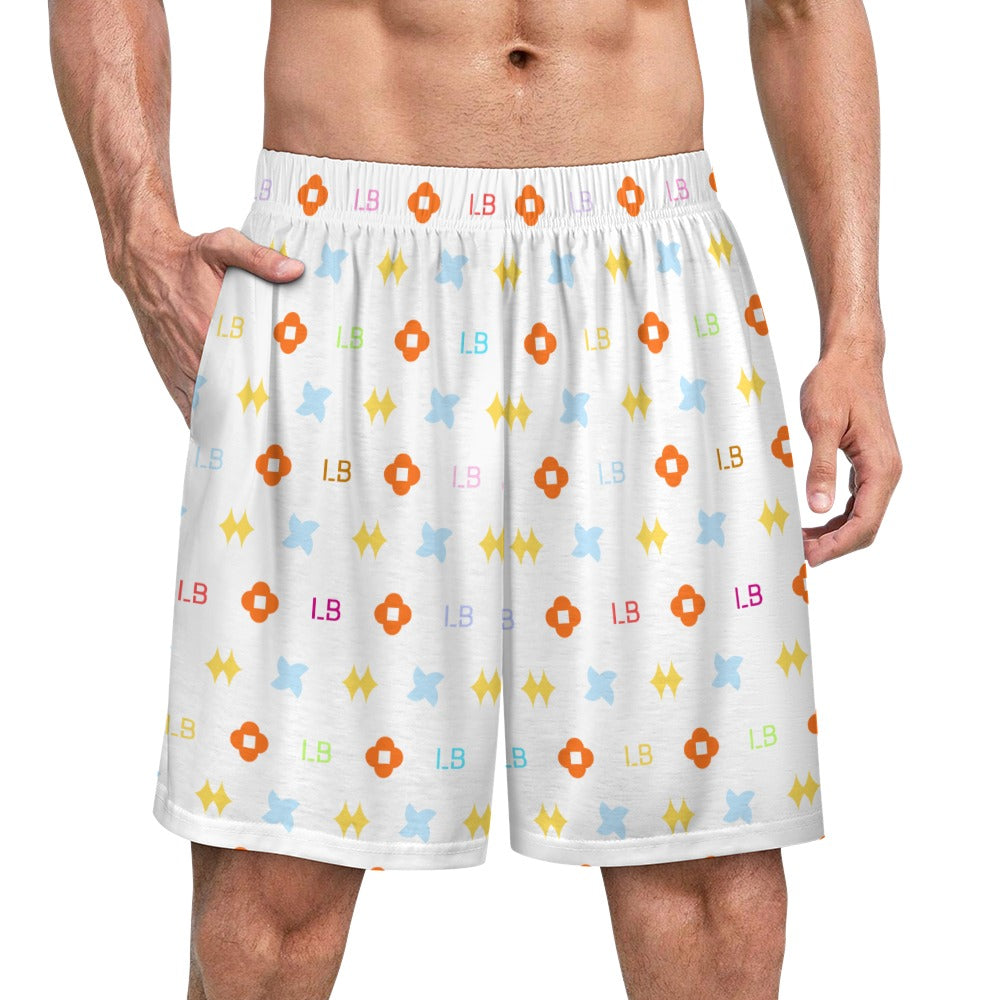 White shorts with colorful geometric and letter patterns; orange, blue, yellow, and pink.