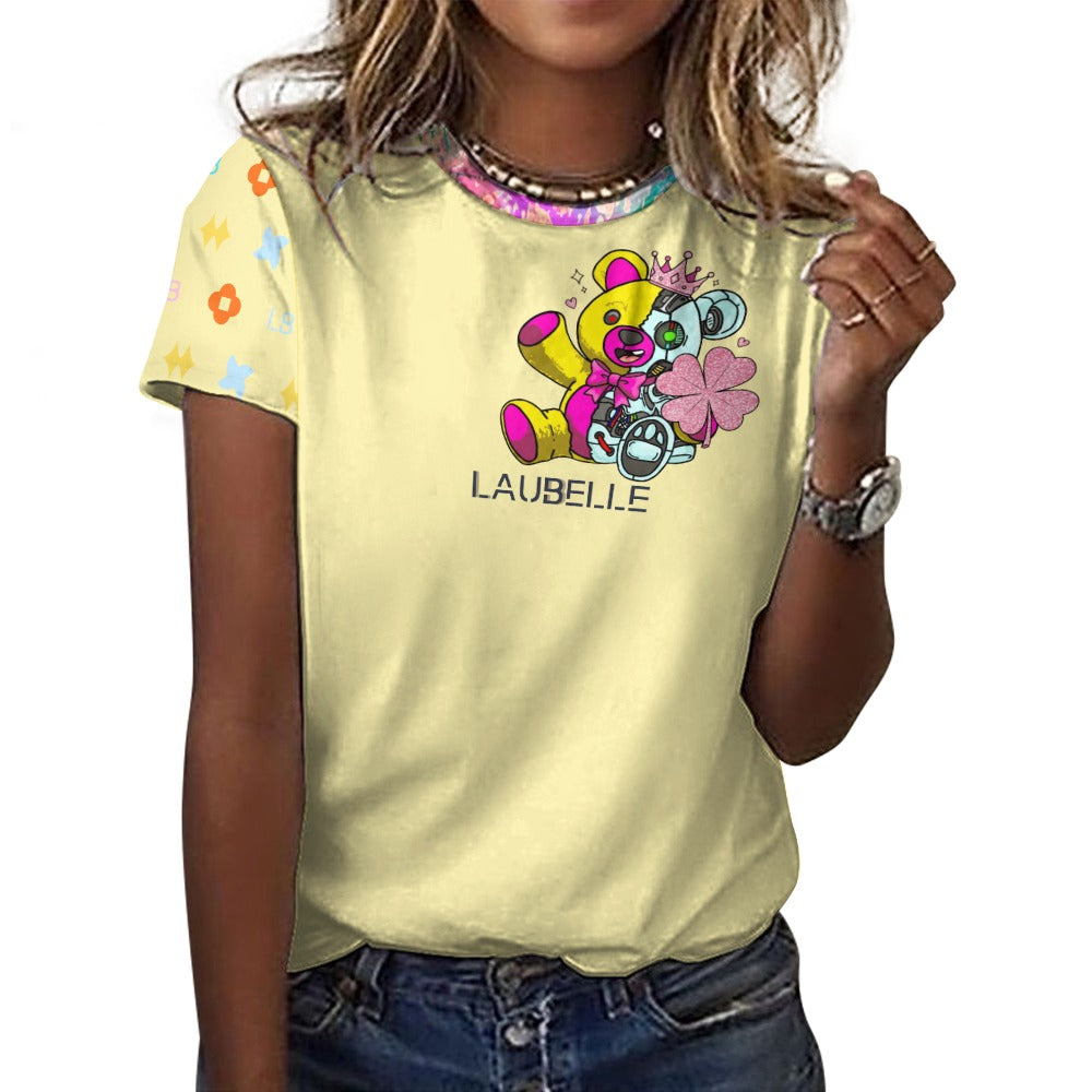 Woman in a yellow T-shirt with colorful bear graphic, patterned sleeve, and blue jeans.