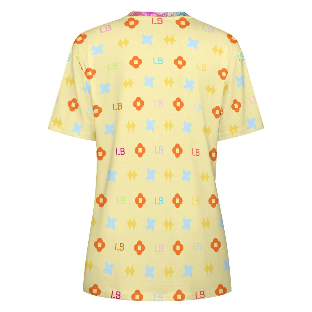 Yellow T-shirt with colorful geometric patterns and letters in orange, blue, and red.