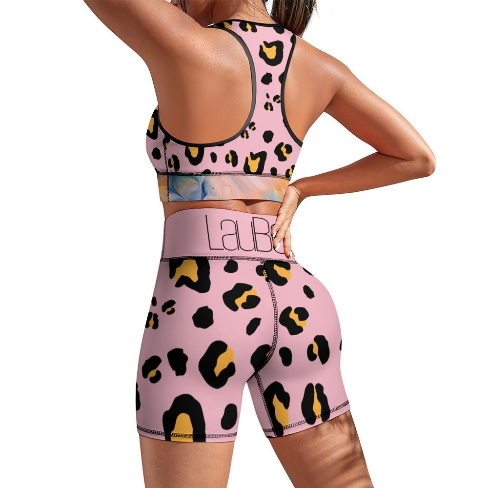 Person in pink leopard print activewear set, featuring a racerback top and high-waisted shorts.
