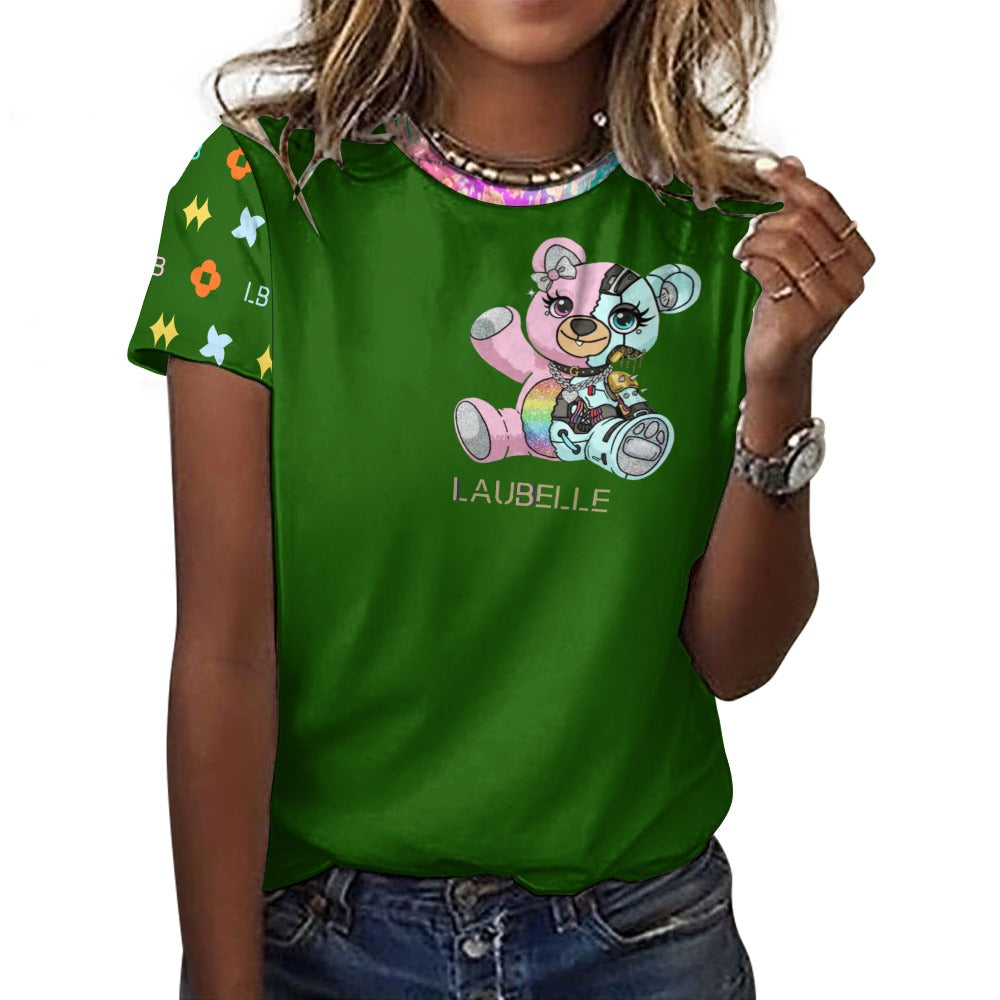 Woman in green shirt with colorful bear design and patterned sleeves, wearing jeans.
