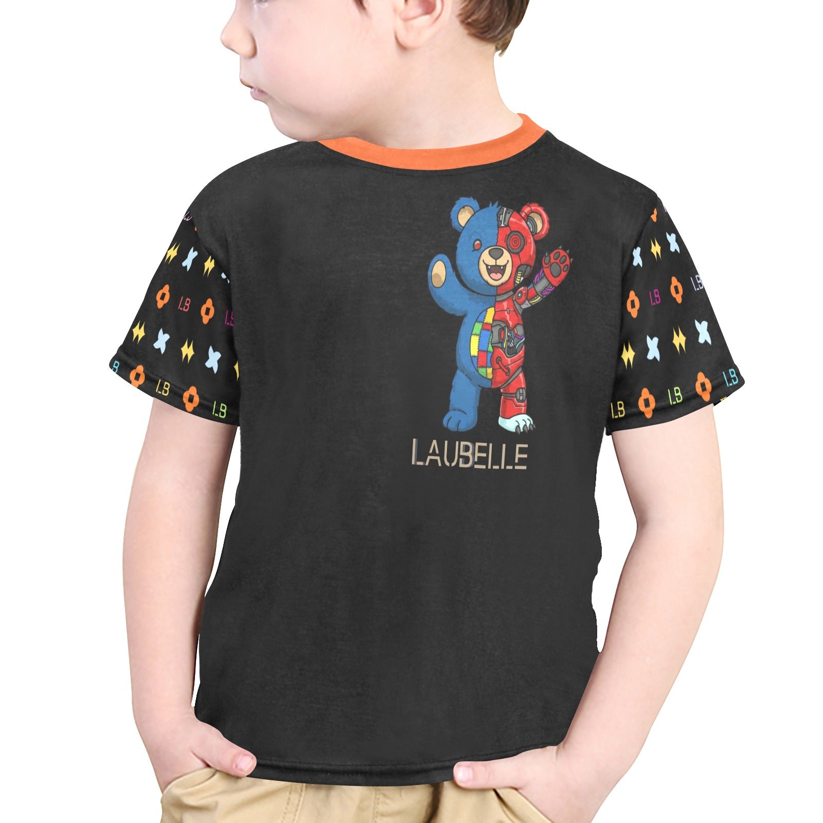 Child in a black shirt with colorful bears and patterns on sleeves, orange collar trim.