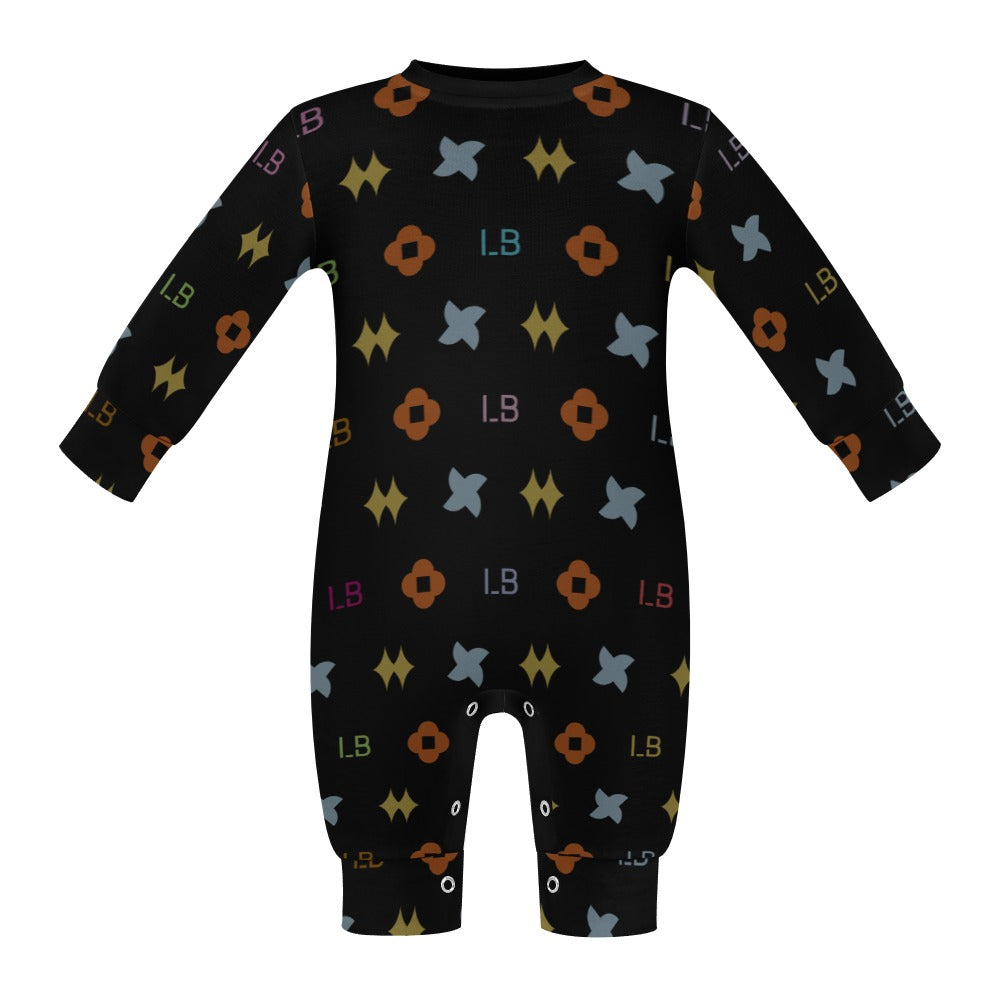 Black baby onesie with multicolored geometric patterns and small symbols.