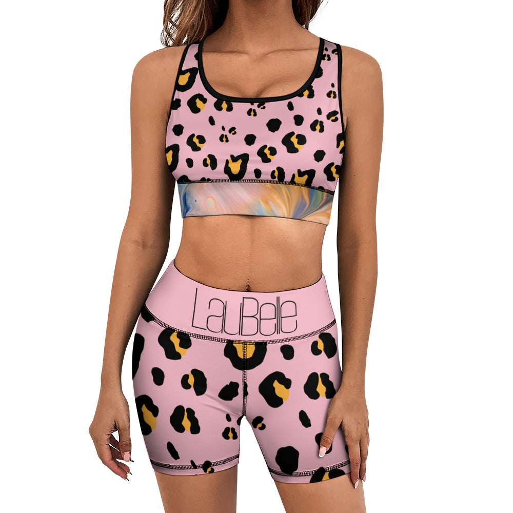 Woman in pink leopard print sports bra and shorts with "LaBela" logo on waistband.