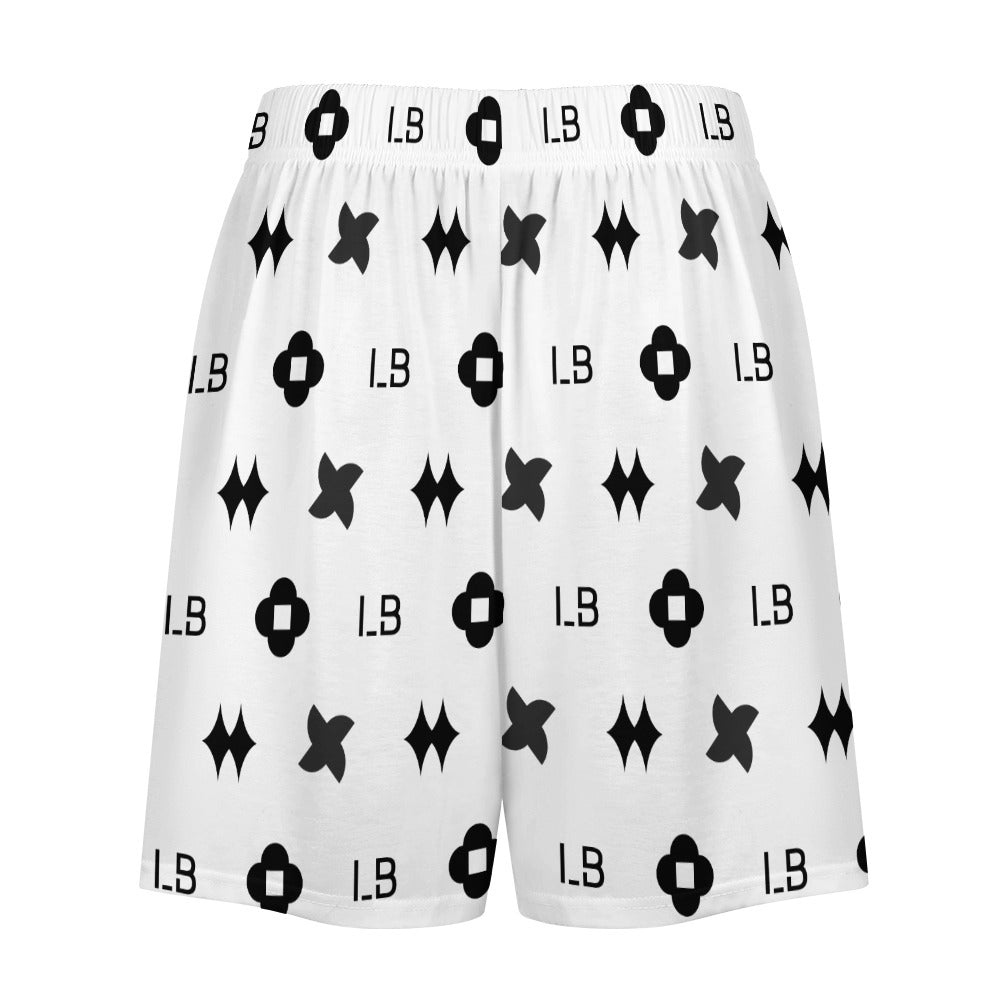 White shorts with black geometric and letter "L.B" patterns. Elastic waistband; symmetrical design.