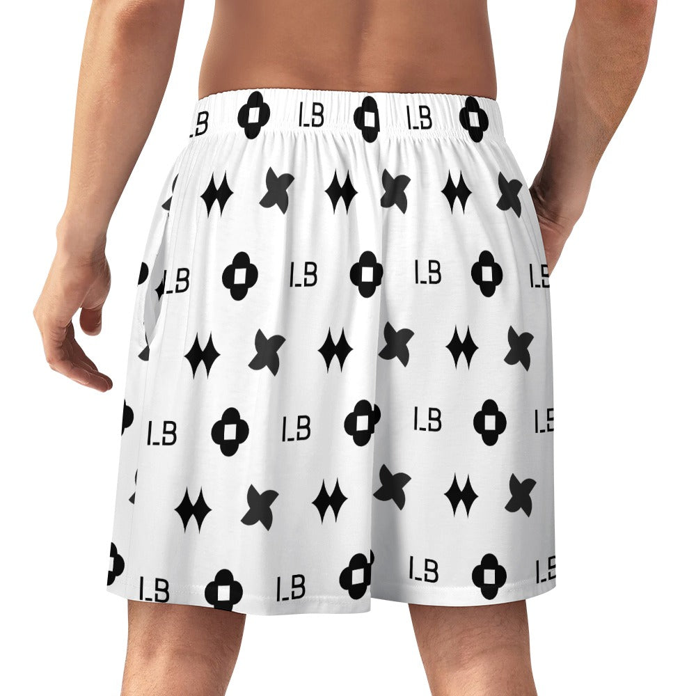 White shorts with black geometric and letter patterns, worn by a person shown from the back.