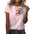 Woman in a pink shirt with colorful bear graphic, patterned sleeves, and jeans.