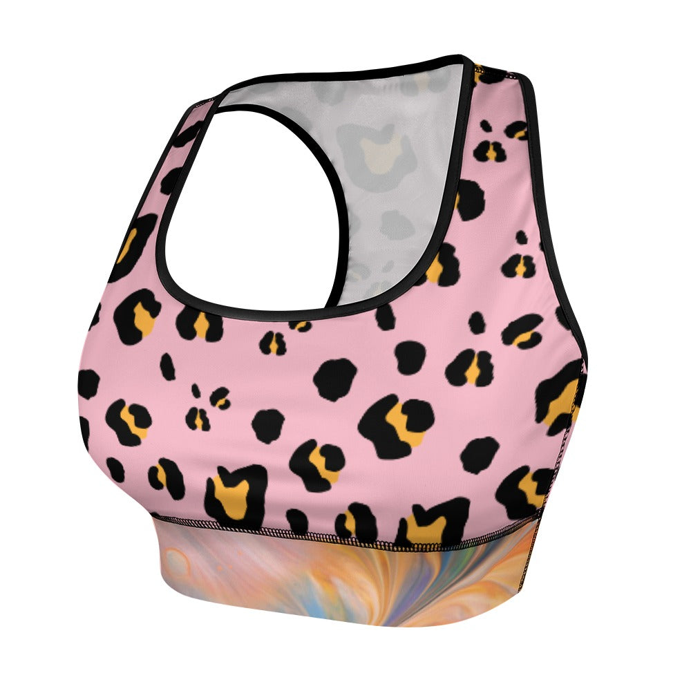 Pink sports bra with black and yellow leopard print, featuring a colorful abstract pattern below.