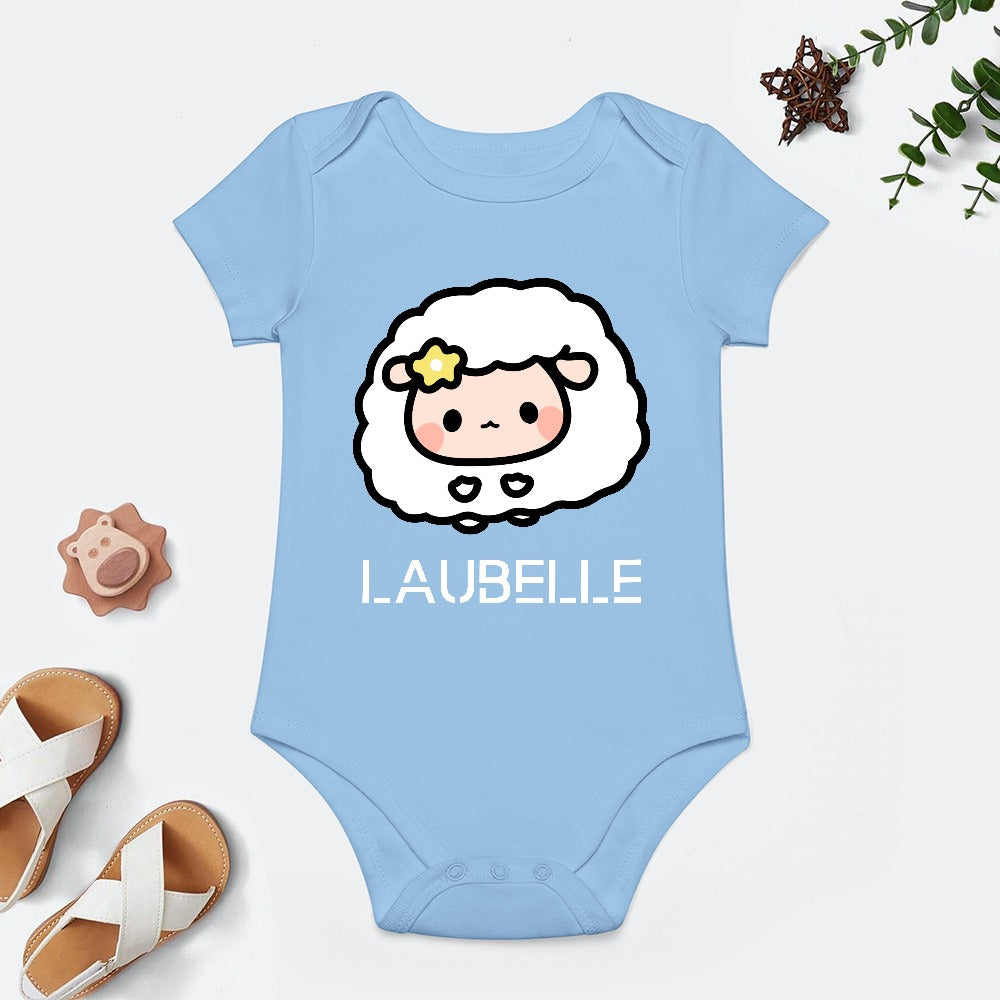 Blue baby onesie with a cute sheep graphic, star detail, and "LAUBELLE" text. White sandals nearby.