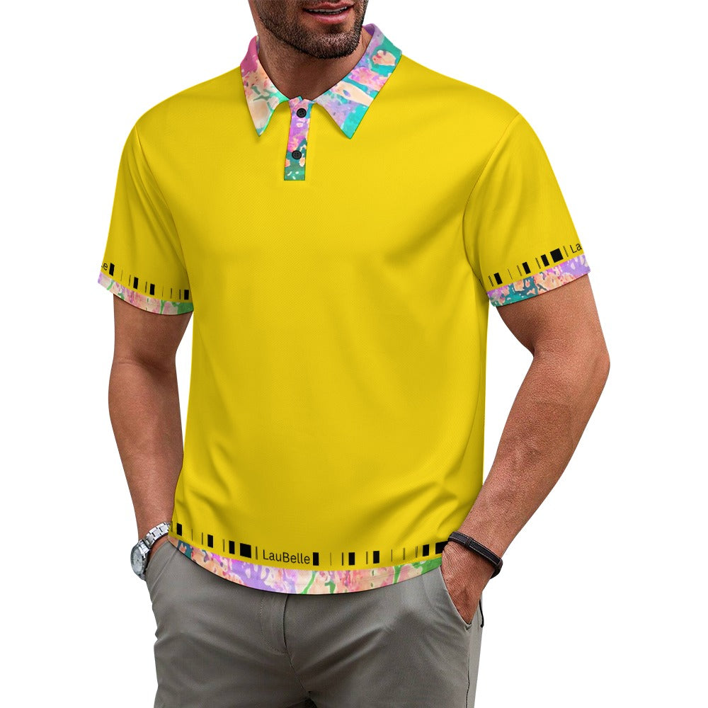 Man wears a bright yellow shirt with colorful floral collar and sleeve trim, hands in pockets.