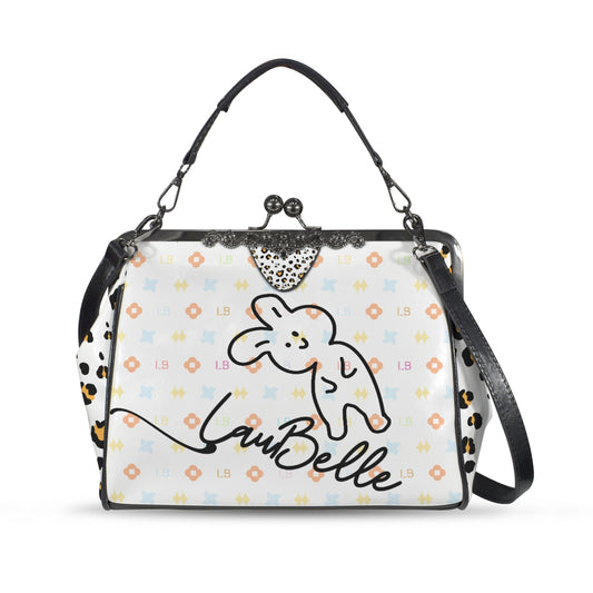 White handbag with a cartoon bunny, colorful patterns, and "LauBelle" text. Black straps and clasp.