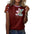 Woman wearing a red shirt with a colorful teddy bear design and patterned sleeves.
