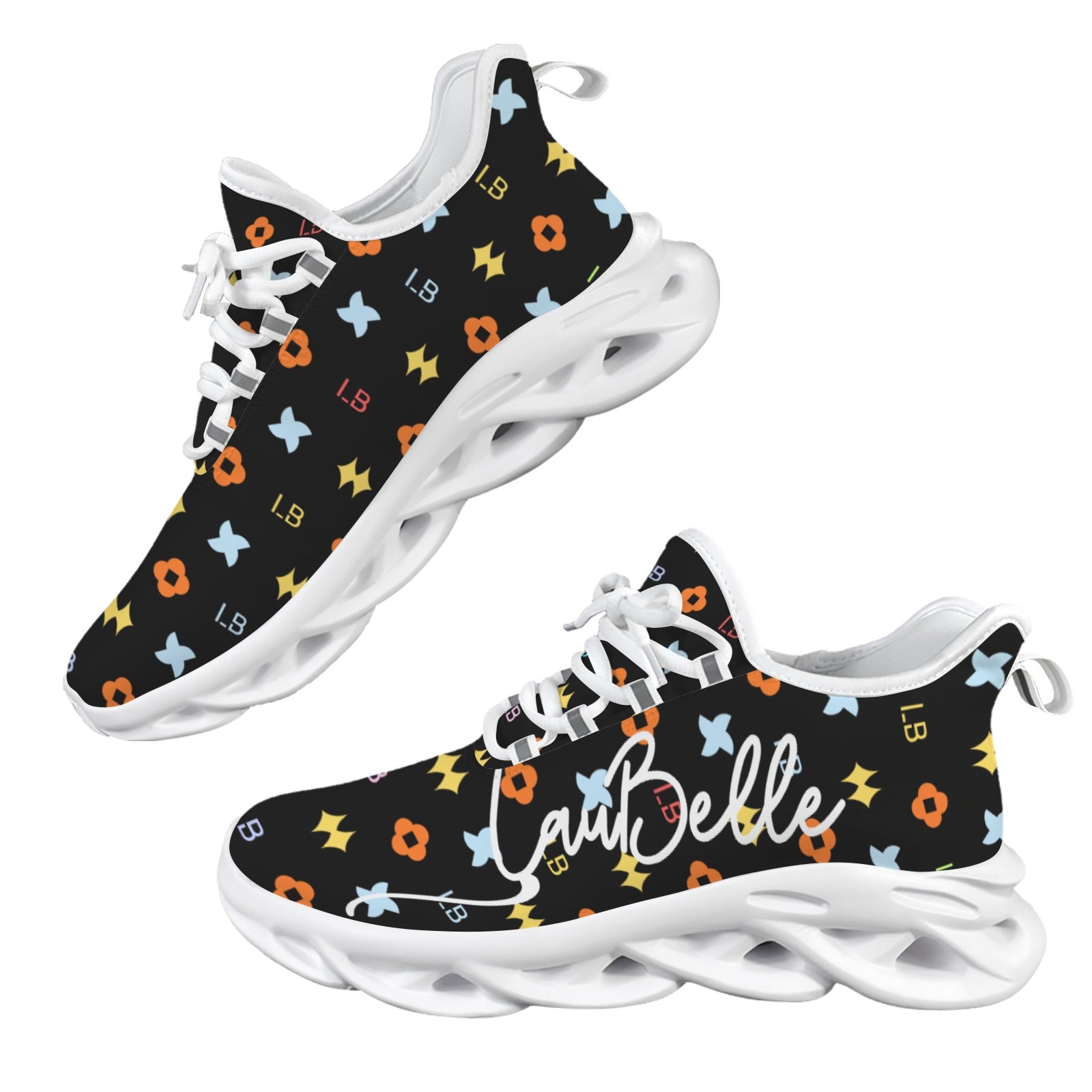 Black sneakers with colorful floral patterns, white laces, and thick white soles.
