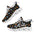Black sneakers with colorful floral patterns, white laces, and thick white soles.