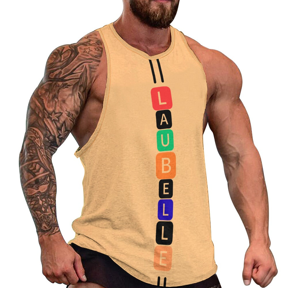 Muscular man in a yellow tank top with colorful vertical lettering and tattoos on his right arm.